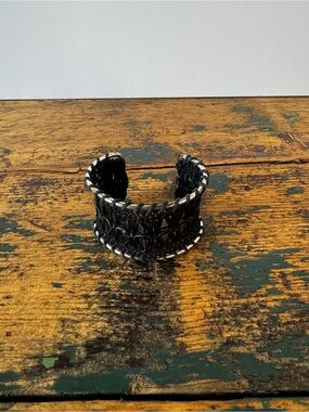 Black Woven Leather Cuff Bracelet with Silver Colored Metal